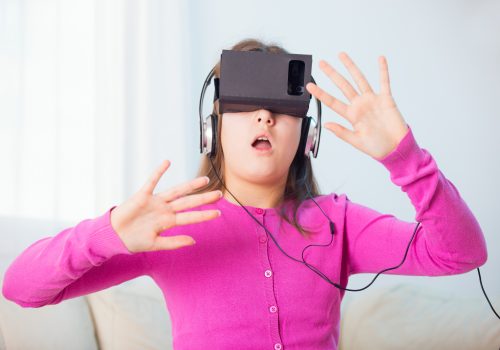 Girl Playing Video Game With Virtual Reality Headset