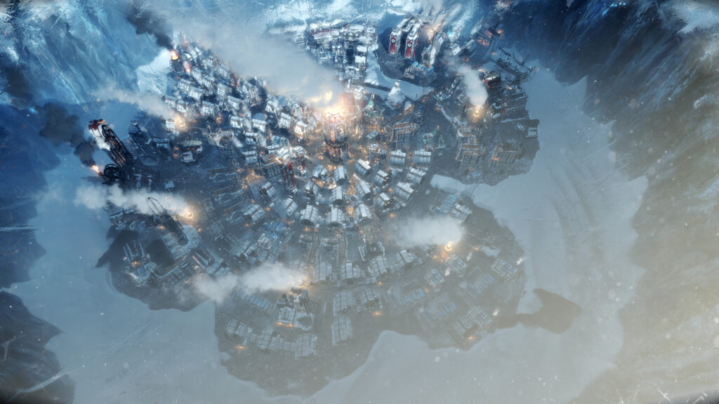 Eine große Stadt inmitten eines eisigen Kraters in Frostpunk. Die zahlreichen Feuergeneratoren hüllen die steampunkige Stadt etwas in Rauch.